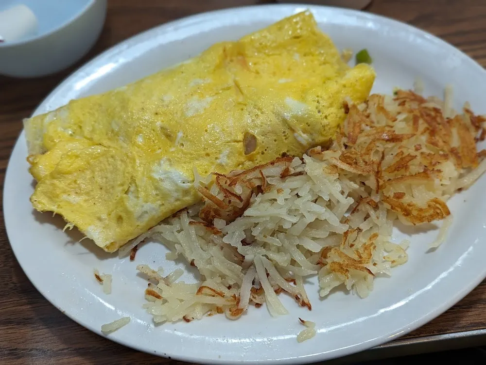 The Chesterton Omlete with Cheese and Hashbrowns